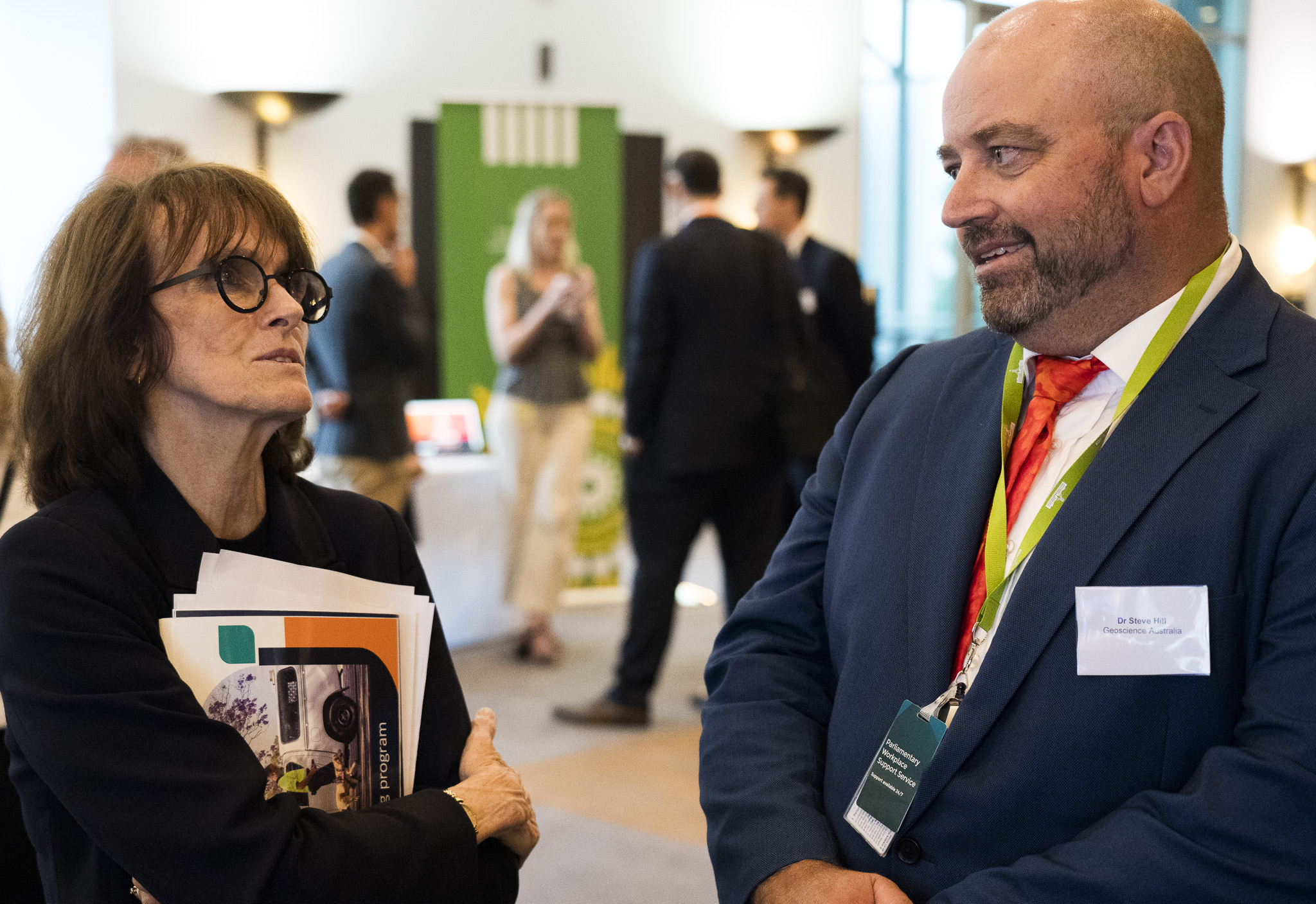 Dr Cathy Foley speaks with Dr Steve Hill, Geosciences Australia, at the Government Scientists Group showcase