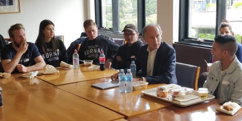 Dr Finkel informally speaking with high school seniors over school lunch